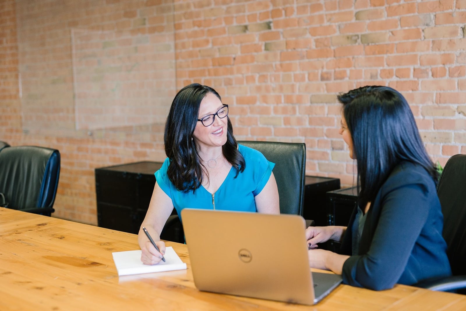 An Online VA Team account manager reviewing hand-picked teammate profiles with a client — interview-stage matching, not algorithmic shortlisting