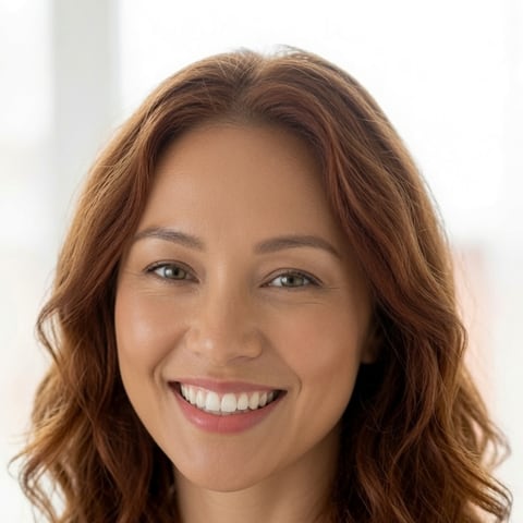 A smiling Online VA Team executive-assistant teammate in a bright, sunlit office